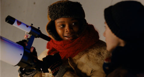 home-for-christmas_stills_girl-on-the-roof-looks-at-the-boy.jpg